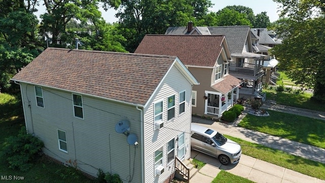 11219 Hopkins, Cleveland, OH 44108 - aerial view of property and surrounding area with a tree filled landscape
