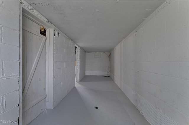 533 12th St, Campbell, OH 44405 - corridor featuring finished concrete flooring and concrete block wall