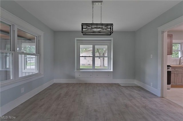 533 12th St, Campbell, OH 44405 - unfurnished dining area with wood finished floors and baseboards