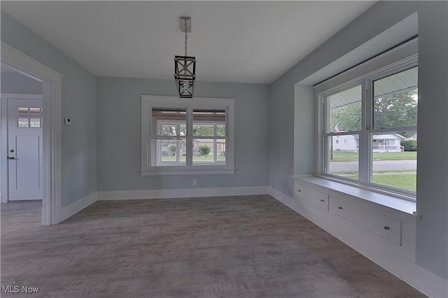 533 12th St, Campbell, OH 44405 - unfurnished dining area featuring plenty of natural light and wood finished floors
