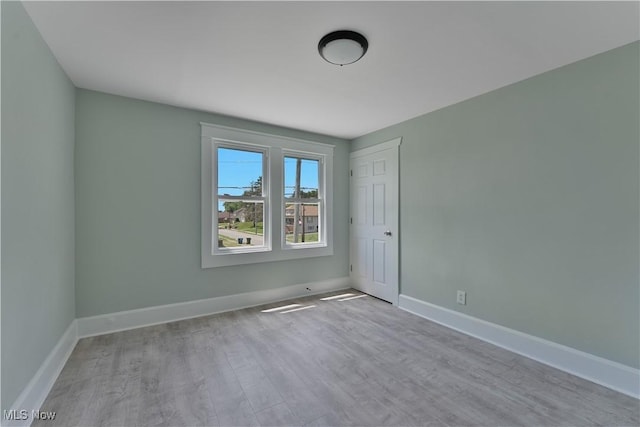 533 12th St, Campbell, OH 44405 - unfurnished room with wood finished floors and baseboards