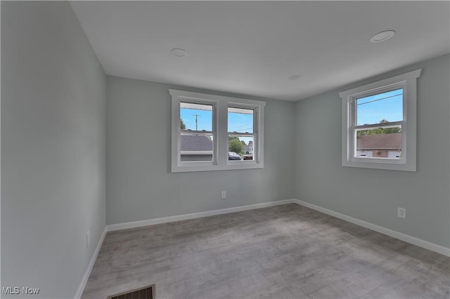 533 12th St, Campbell, OH 44405 - unfurnished room featuring plenty of natural light and wood finished floors