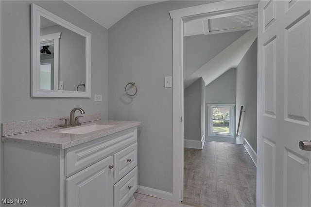 533 12th St, Campbell, OH 44405 - bathroom featuring vaulted ceiling, vanity, and wood finished floors