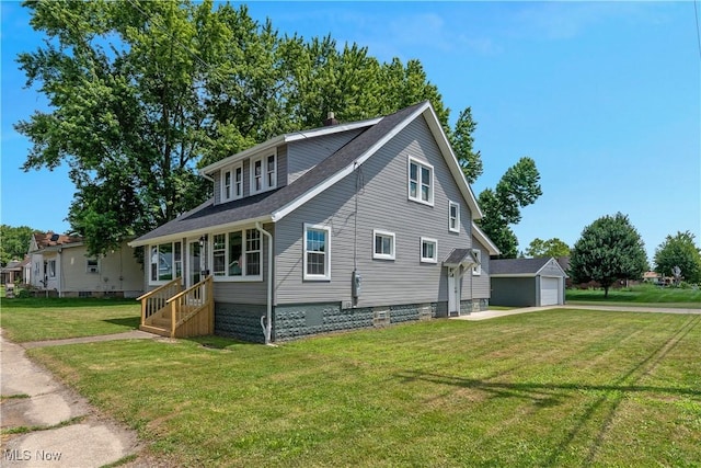 533 12th St, Campbell, OH 44405 - view of front of property featuring a garage, a front lawn, an outdoor structure, and roof with shingles