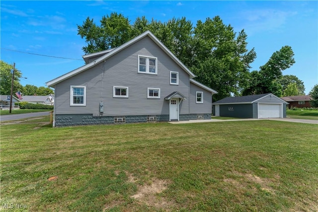 533 12th St, Campbell, OH 44405 - view of front of home with a detached garage, a front lawn, and an outdoor structure