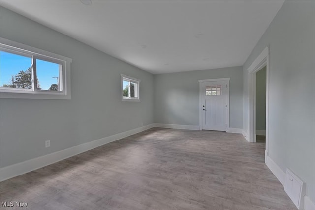 533 12th St, Campbell, OH 44405 - unfurnished room featuring plenty of natural light and wood finished floors