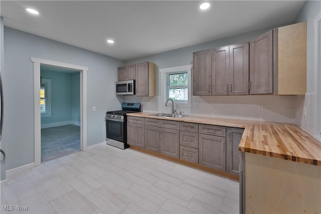 533 12th St, Campbell, OH 44405 - kitchen with appliances with stainless steel finishes, recessed lighting, and wooden counters
