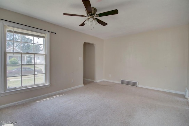4606 Maplecrest Ave, Parma, OH 44134 - carpeted spare room featuring arched walkways, healthy amount of natural light, and a ceiling fan