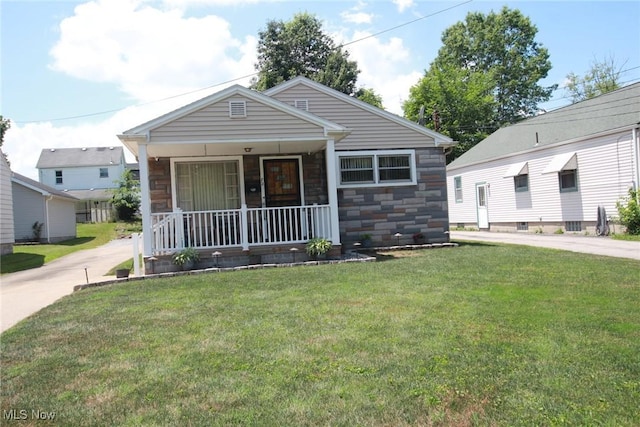 72 S Hartford Ave, Youngstown, OH 44509 - view of front of home featuring a porch, a front yard, and stone siding