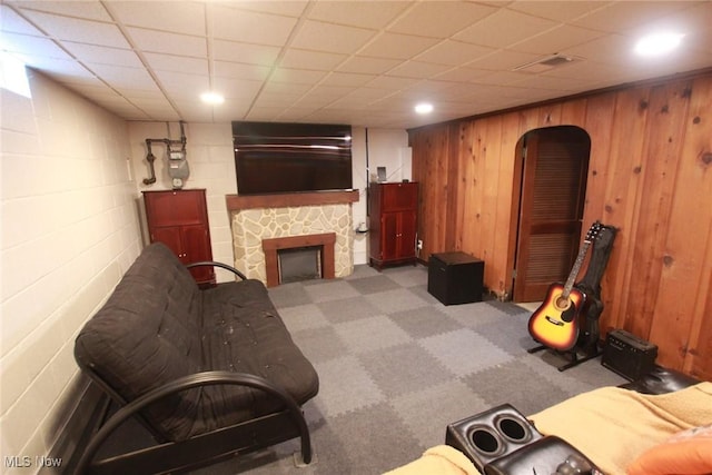 72 S Hartford Ave, Youngstown, OH 44509 - carpeted living area with a fireplace, concrete block wall, and arched walkways
