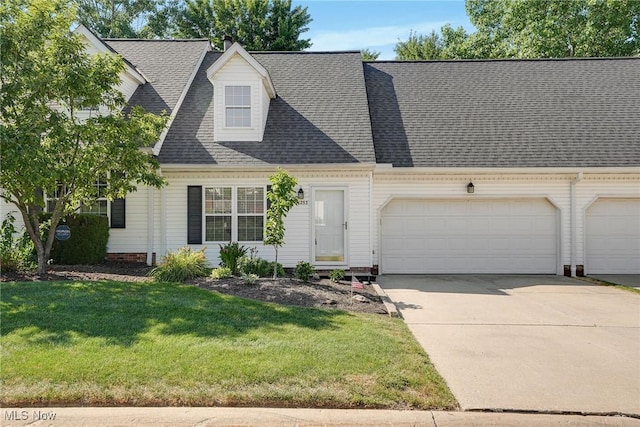11253 Hampton Bay Ln, Concord, OH 44077 - new england style home featuring a front lawn, concrete driveway, a garage, and a shingled roof