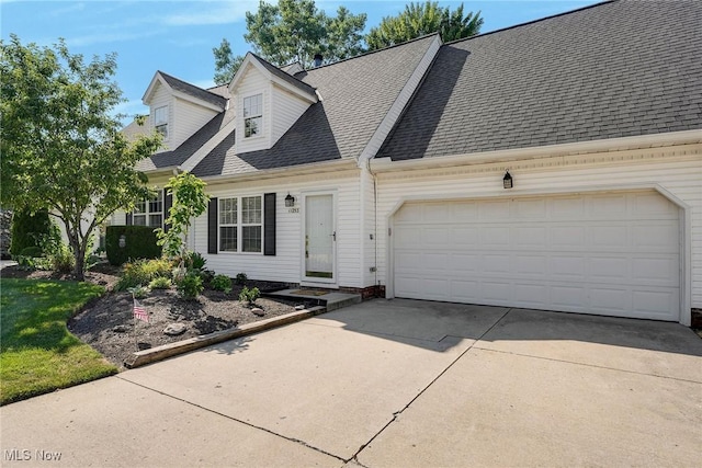 11253 Hampton Bay Ln, Concord, OH 44077 - view of front of home with driveway, a garage, and roof with shingles