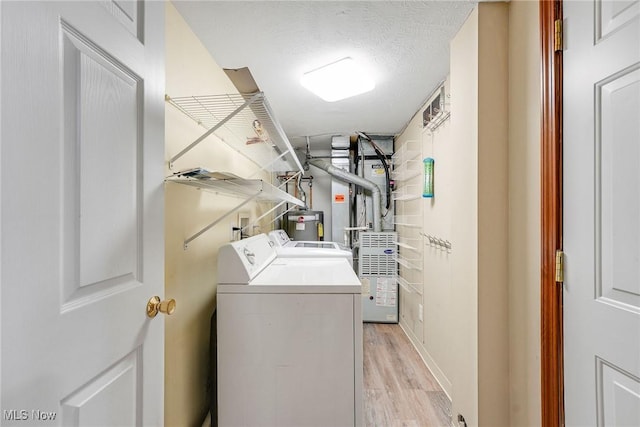 11253 Hampton Bay Ln, Concord, OH 44077 - laundry area with separate washer and dryer and light wood-type flooring