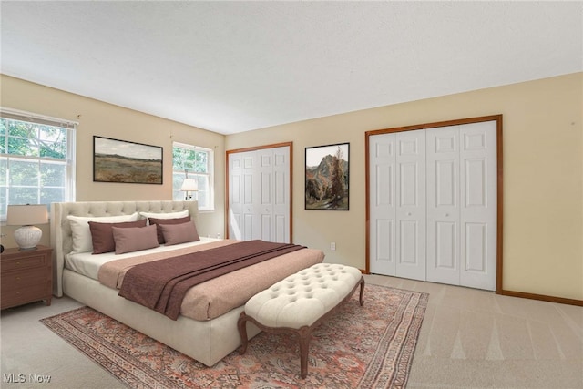 11253 Hampton Bay Ln, Concord, OH 44077 - bedroom featuring multiple closets, light colored carpet, and multiple windows