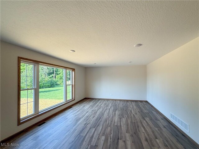 700 Whitetail Crossings, Wooster, OH 44691 - spare room featuring dark wood-style floors and a textured ceiling