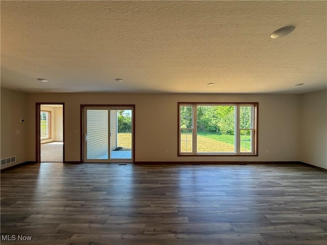 700 Whitetail Crossings, Wooster, OH 44691 - unfurnished room featuring dark wood-type flooring, a textured ceiling, and recessed lighting