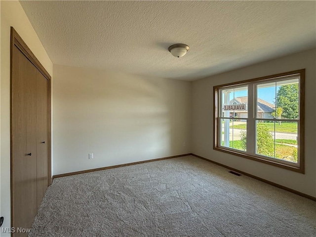 700 Whitetail Crossings, Wooster, OH 44691 - empty room with carpet and a textured ceiling