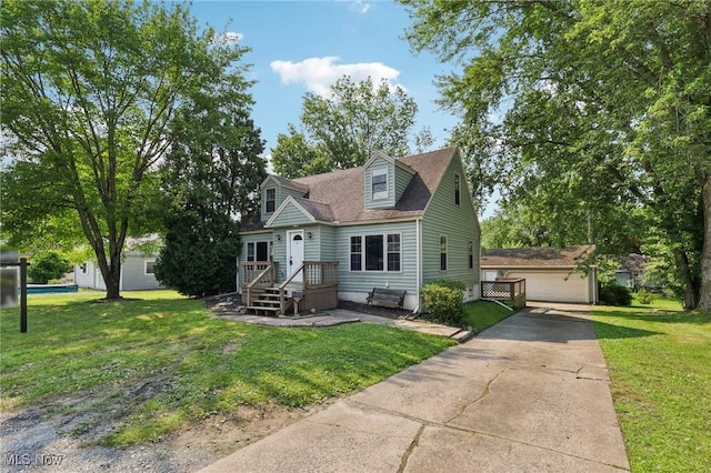 1811 Stepney St, Niles, OH 44446 - cape cod home featuring a front yard and an outdoor structure