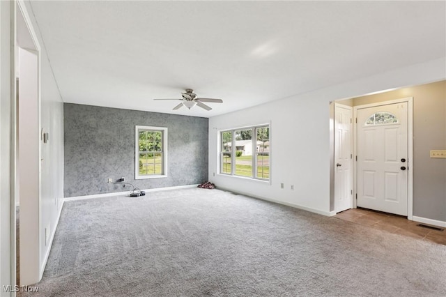 1811 Stepney St, Niles, OH 44446 - unfurnished living room with carpet floors and ceiling fan