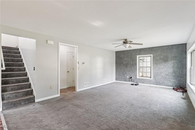 1811 Stepney St, Niles, OH 44446 - empty room with a ceiling fan, stairs, and carpet flooring