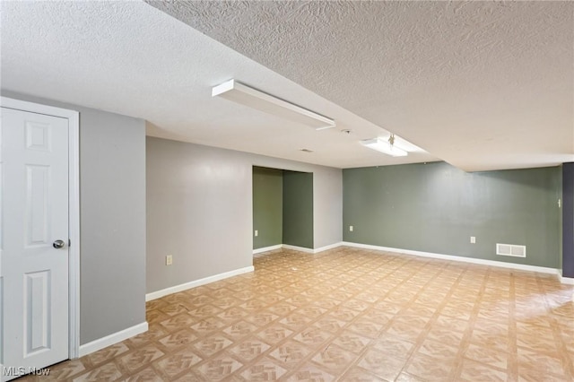 1811 Stepney St, Niles, OH 44446 - finished below grade area with a textured ceiling and light floors