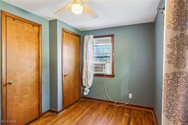 2992 Eldora Dr, Youngstown, OH 44511 - unfurnished bedroom with wood finished floors, a closet, cooling unit, and a ceiling fan