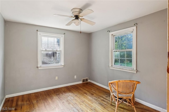 2992 Eldora Dr, Youngstown, OH 44511 - empty room with wood finished floors and ceiling fan