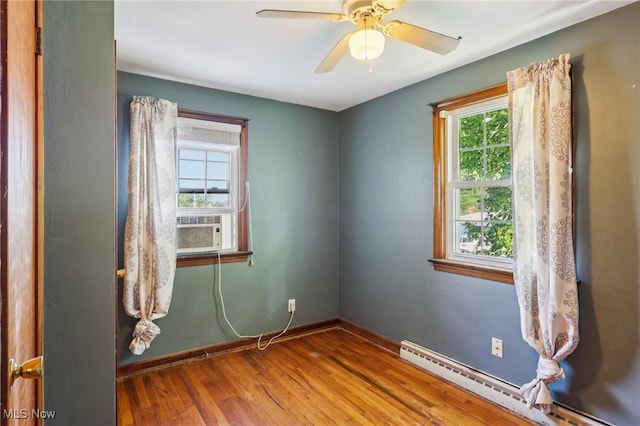 2992 Eldora Dr, Youngstown, OH 44511 - spare room featuring a baseboard radiator, wood finished floors, and ceiling fan