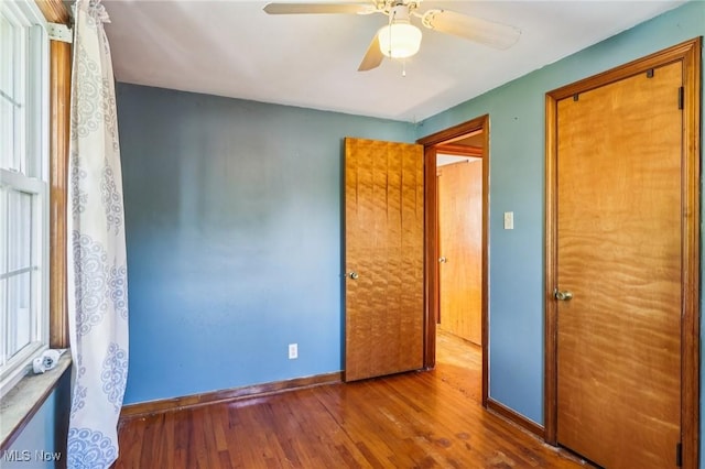 2992 Eldora Dr, Youngstown, OH 44511 - unfurnished bedroom with wood finished floors and a ceiling fan