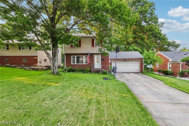 2992 Eldora Dr, Youngstown, OH 44511 - view of front of home featuring a front lawn, brick siding, driveway, and a garage
