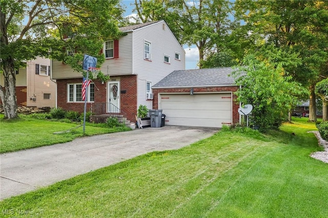 2992 Eldora Dr, Youngstown, OH 44511 - colonial-style house featuring brick siding, concrete driveway, an attached garage, and a front yard
