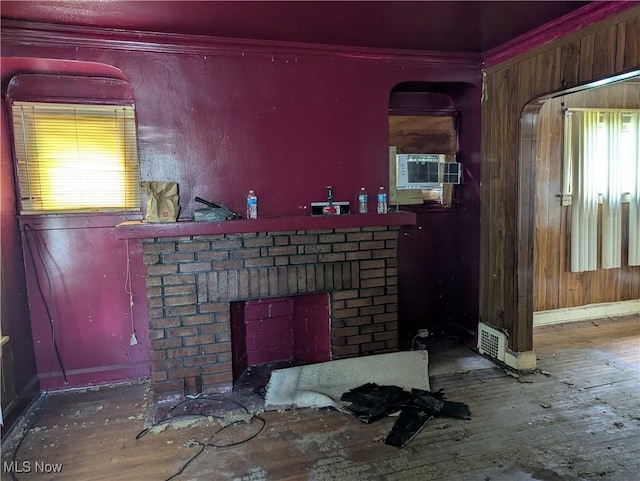 14717 Orinoco Ave, East Cleveland, OH 44112 - detailed view of a brick fireplace, cooling unit, wood finished floors, and crown molding