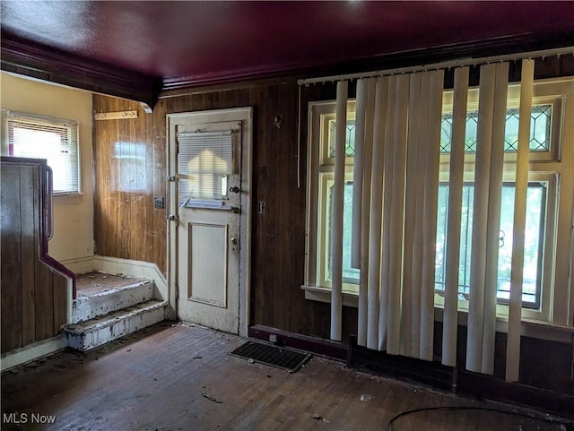 14717 Orinoco Ave, East Cleveland, OH 44112 - entryway featuring wood-type flooring and wooden walls