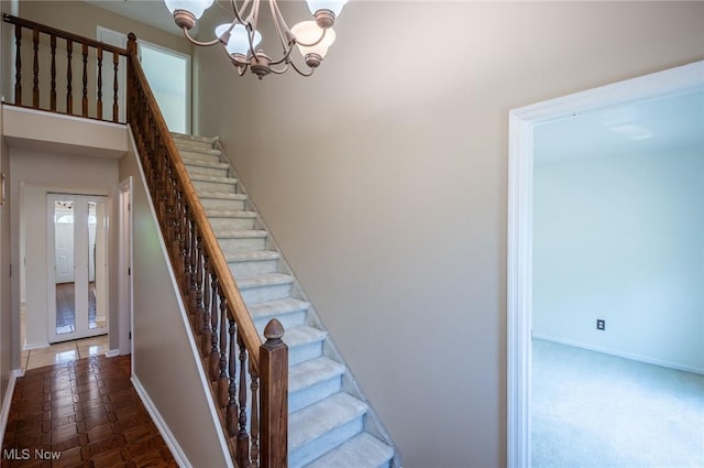 24 Heather Cir, Washington, WV 26181 - stairs with baseboards and a chandelier