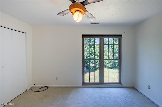 24 Heather Cir, Washington, WV 26181 - unfurnished bedroom featuring carpet flooring, a closet, and ceiling fan