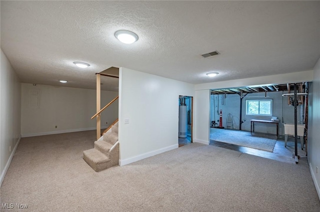 24 Heather Cir, Washington, WV 26181 - basement featuring gas water heater, carpet floors, a textured ceiling, and stairs
