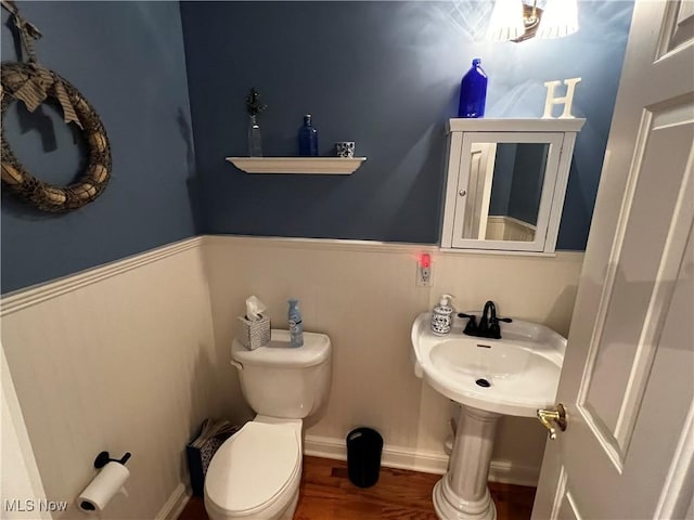 660 Rustic Knoll Dr, Kent, OH 44240 - half bathroom featuring toilet and wood finished floors