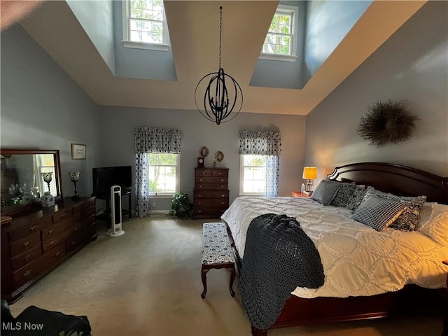 660 Rustic Knoll Dr, Kent, OH 44240 - carpeted bedroom with a towering ceiling, multiple windows, and a chandelier