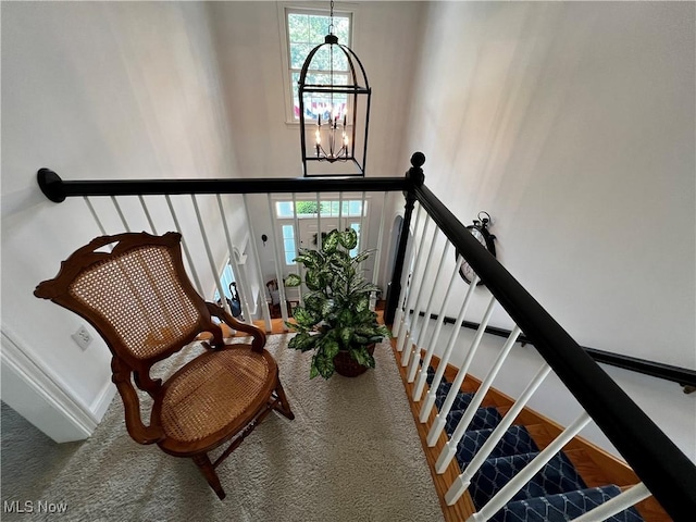 660 Rustic Knoll Dr, Kent, OH 44240 - stairs featuring a chandelier, carpet flooring, and a high ceiling