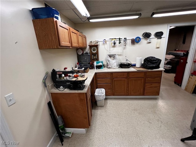 660 Rustic Knoll Dr, Kent, OH 44240 - kitchen with brown cabinets, light countertops, and a drop ceiling