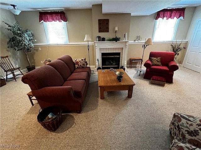 660 Rustic Knoll Dr, Kent, OH 44240 - carpeted living area featuring healthy amount of natural light and a tiled fireplace