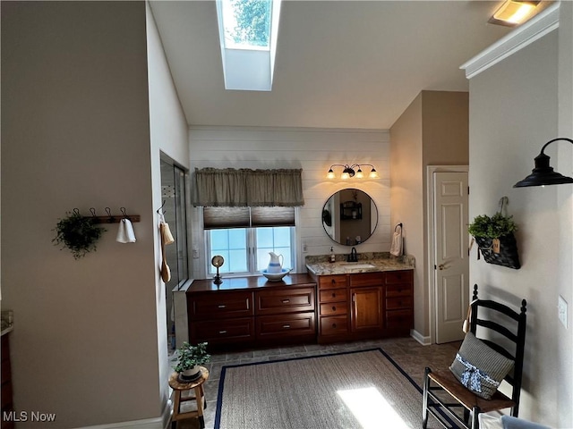 660 Rustic Knoll Dr, Kent, OH 44240 - bathroom featuring vanity, a skylight, lofted ceiling, and tile patterned floors