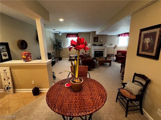 660 Rustic Knoll Dr, Kent, OH 44240 - living area with a tile fireplace, carpet flooring, and tile patterned floors
