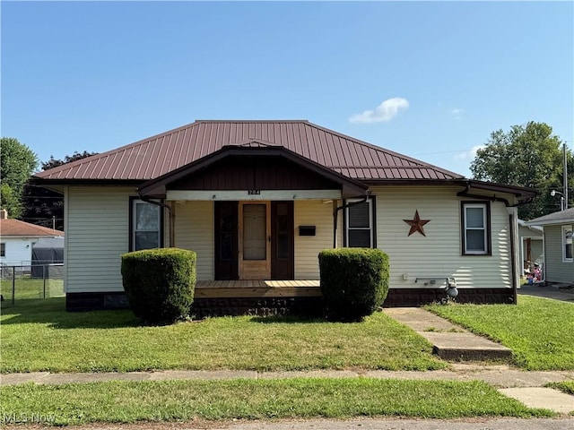 204 E 4th St, West Lafayette, OH 43845 - bungalow-style house featuring a porch and a metal roof