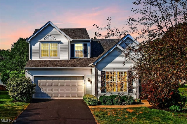 1648 E Turkey Run Dr, Newark, OH 43055 - traditional-style home featuring a garage, driveway, and a shingled roof