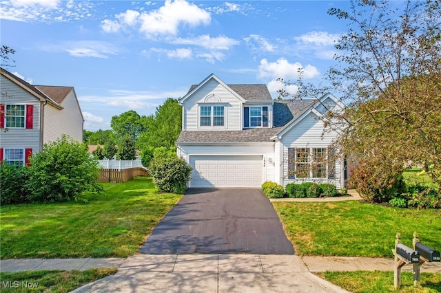 1648 E Turkey Run Dr, Newark, OH 43055 - traditional-style home featuring asphalt driveway, a garage, and a shingled roof