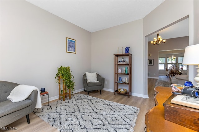 1648 E Turkey Run Dr, Newark, OH 43055 - living area with a chandelier, wood finished floors, and vaulted ceiling