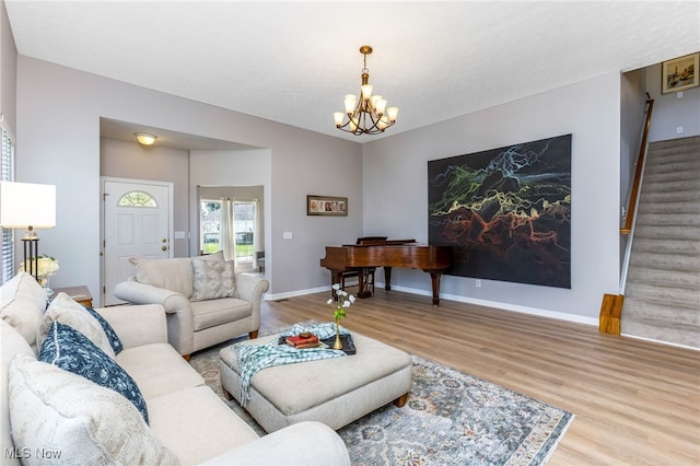 1648 E Turkey Run Dr, Newark, OH 43055 - living area featuring wood finished floors, stairs, and a chandelier