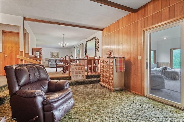 136 N Chillicothe Rd, Aurora, OH 44202 - carpeted living room featuring a chandelier, wooden walls, and beamed ceiling