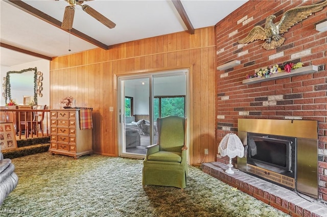136 N Chillicothe Rd, Aurora, OH 44202 - carpeted living area with wooden walls, beam ceiling, a fireplace, and ceiling fan